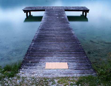 A jetty on the shore of Lake Annecy in France.  This image was taken at dusk in mid-Spring.