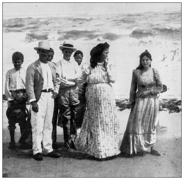 Antique black and white photograph: Puerto Rican on Arecibo Beach, Puerto Rico Antique black and white photograph of people from islands in the Caribbean and in the Pacific Ocean; Cuba, Hawaii, Philippines and others: Puerto Rican on Arecibo Beach, Puerto Rico puerto rican culture stock illustrations