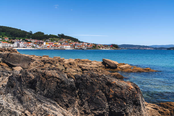 istock Coastal village with sea and rocks 1326581852