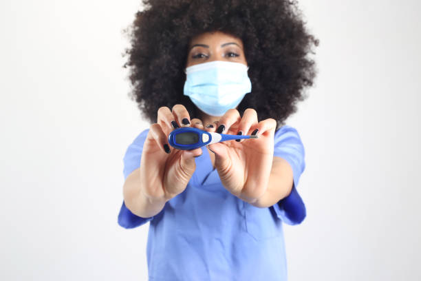 Afro female doctor, with thermometer, white background