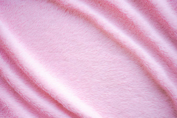istock Pink fabric cotton background. display  abstract texture luxury cloth soft wave. 1326582142