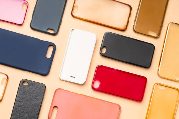 istock Pile of multicolored plastic back covers for mobile phone. Choice of smart phone protector accessories on neutral background. A lot of silicone phone backs or skins next to each other 1326583250