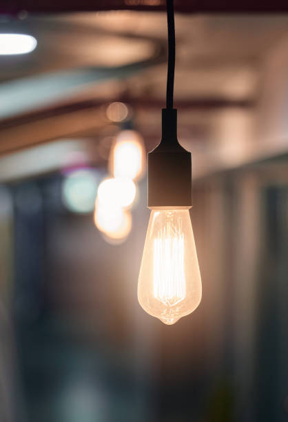 istock Shot of a lightbulb hanging from the ceiling in an empty office in the evening 1326592774