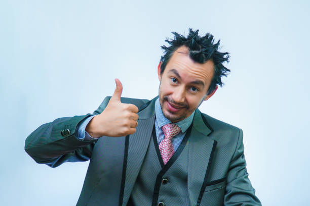istock Funny unshaven man in suit with tie on gray background 1326605706