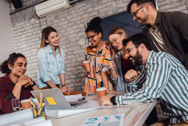 istock Group of young people discussing architectural designs in the creative office. 1326607682
