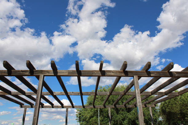 istock Wooden pergola with a sky with background clouds 1326607704