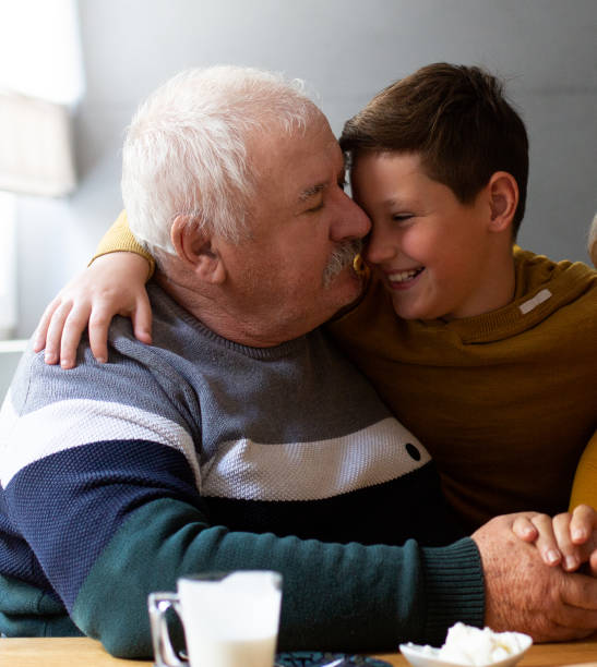 istock Granddaddy hugging and kissing his grandkid. 1326608799