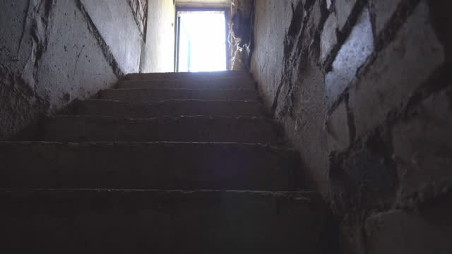 a creepy old brick staircase to a frightening basement or dungeon,