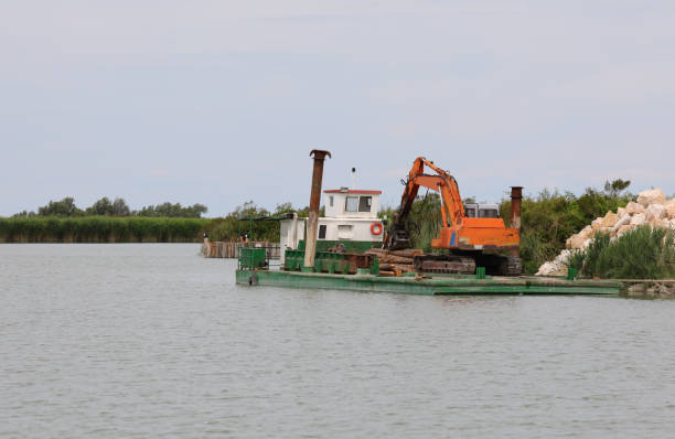istock Bulldozer on the platform on the river 1326610794