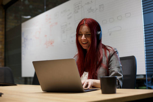 istock Young woman is sitting at the office, having online conversation. 1326611749
