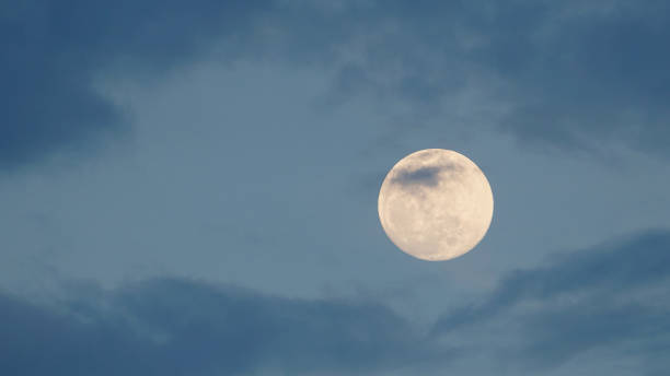 istock Beautiful full moon in the night sky view from Earth. 1326612199