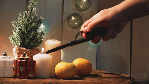 istock Small Christmas tree and candles on a wooden background 1326613319