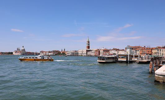 very few boats sailing in the Venice lagoon in Italy due to the tremendous locktown caused by the coronavirus