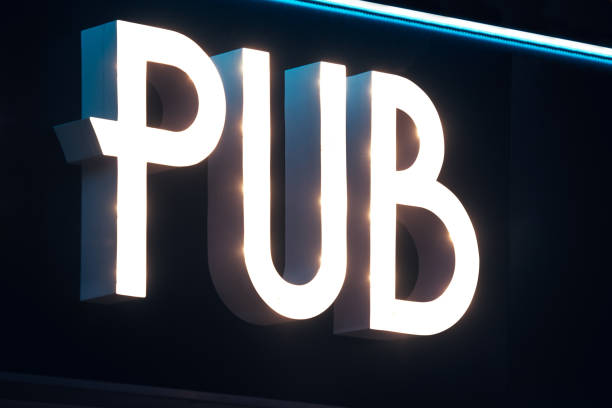 istock Illuminated signboard of pub 1326615054