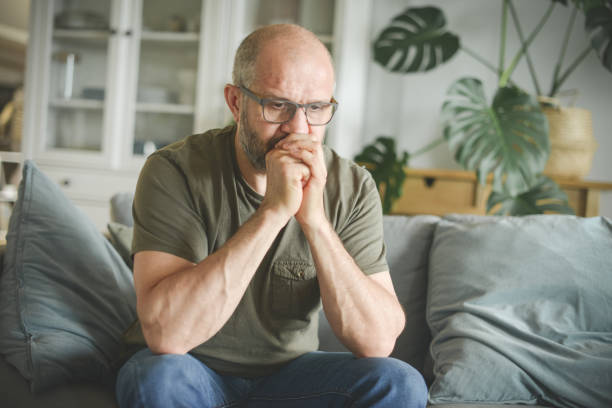 istock mature adult man working from home office ( negative emotion ) 1326616384