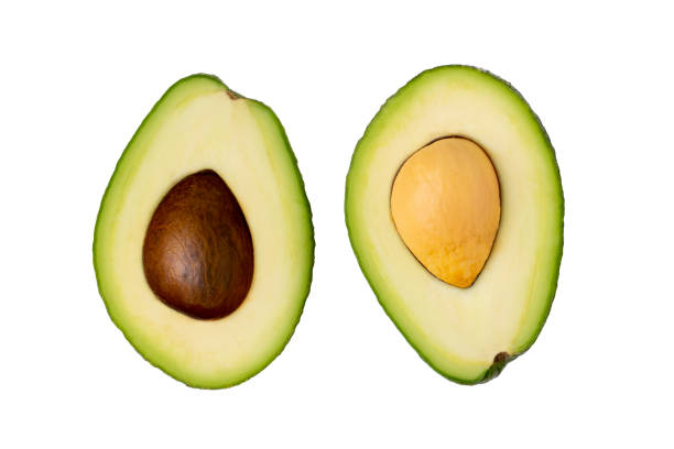 istock Sliced two avocados on a white isolated background, top view. 1326617746