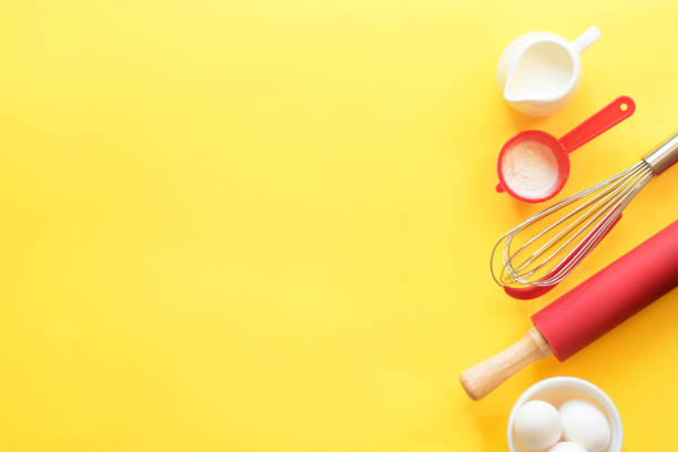istock Kitchen devices for baking and ingredients on a bright yellow background. Top view, copy space. Place for text. 1326617785