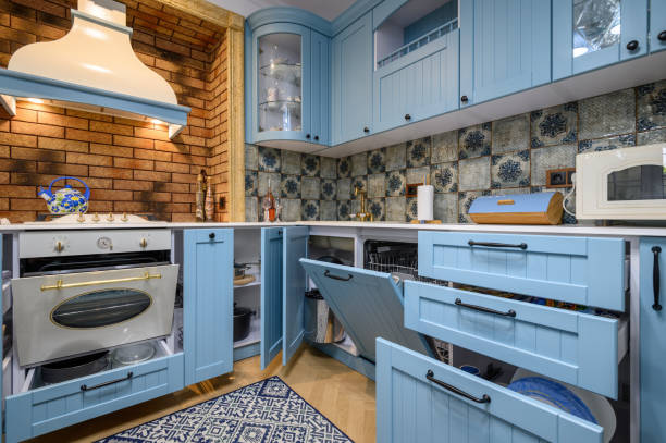 istock Modern classic luxurious kitchen and dining room, drawers and doors open 1326619872