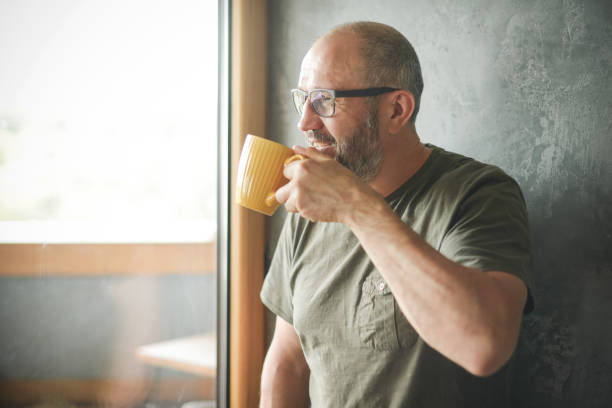 istock mature adult man ( gray background) 1326620774