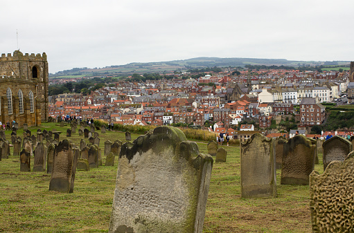 Colour photograph of an old graveyard in Whitby overlooking the town where Dracula is set in England
