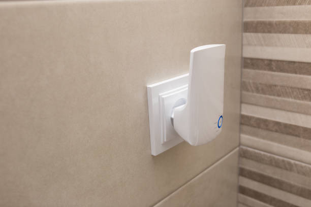 istock Wifi home repeater plugged in closeup 1326620892
