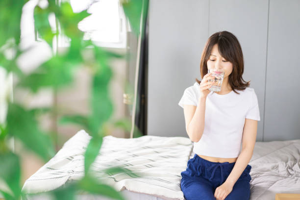 istock A young woman waking up and rehydrating 1326621034