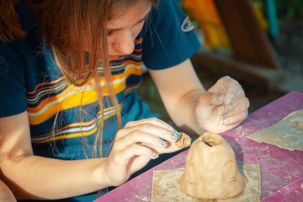 istock Having fun with colorful modeling clay. Creative kids molding at home. 1326621074