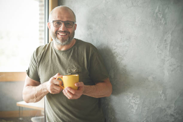 istock mature adult man ( gray background) 1326623299
