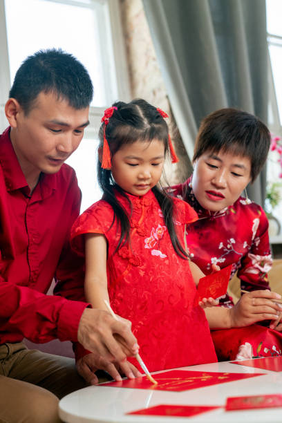 istock Man with paintbrush teaching daughter to paint 1326624906