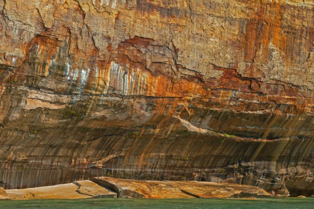 istock Abstract Mineral Stained Cliff Pictured Rocks 1326624907