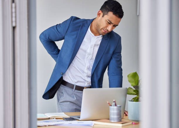 istock Shot of a businessman experiencing back pain at work 1326625064