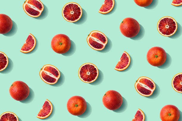 istock Colorful fruit pattern of fresh whole and sliced blood orange 1326625245