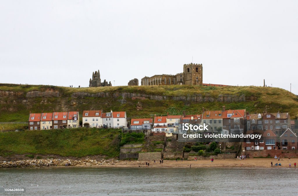 Church of St Mary graveyard & Whitby Abbey Colour photograph of the Church of St Mary graveyard & Whitby Abbey in England Cliff Stock Photo