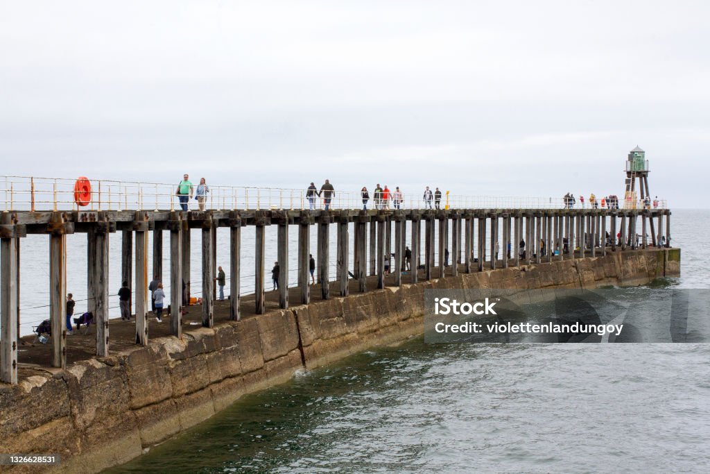 Whitby east pier, North Yorkshire, England Colour photograph of Whitby east pier in Whitby, North Yorkshire, England North Yorkshire Stock Photo