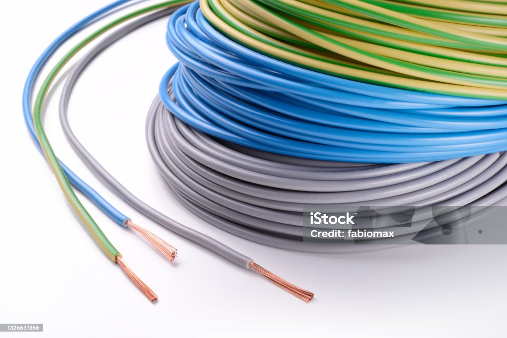 Electrical wires: phase, neutral and ground isolated on white background closeup. Material for electrical installations. Cable Stock Photo