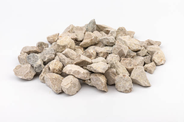 istock Gray small rocks ground texture isolated on white background. Small road stone. 1326632550