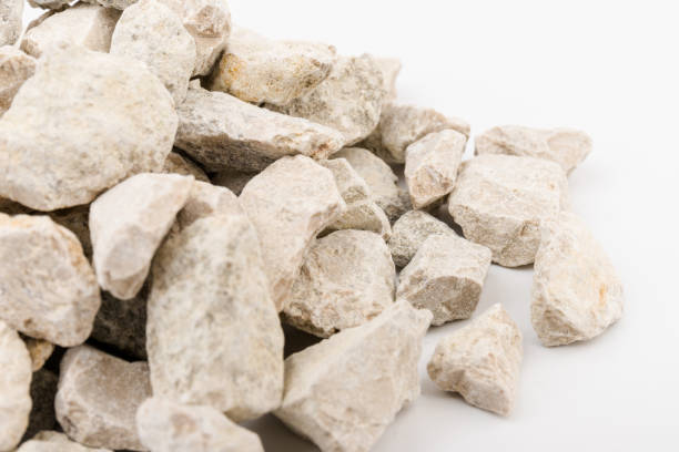istock Gray small rocks ground texture isolated on white background. Small road stone. 1326632605
