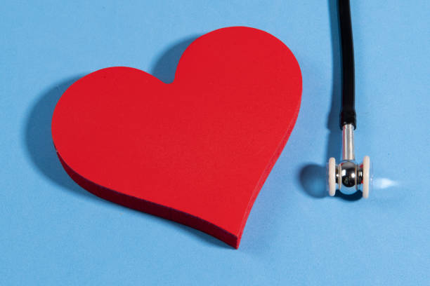 istock heart shape on blue background with a stethoscope 1326632794