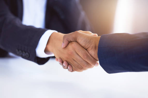 istock Shot of two unrecognizable businessmen shaking hands in a modern office 1326632802