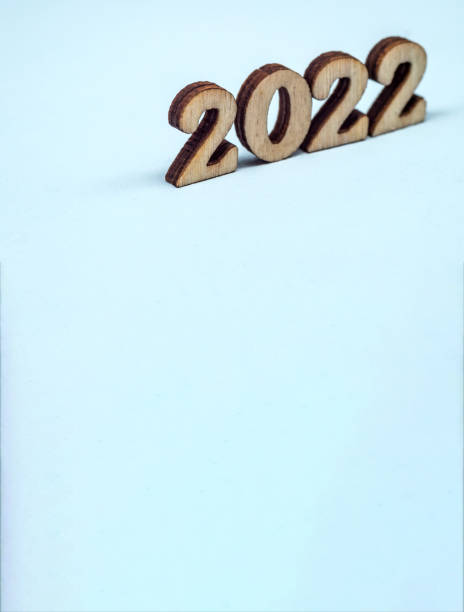 istock Numerals 2022 on blue background. Wooden digits 2022. 1326635698