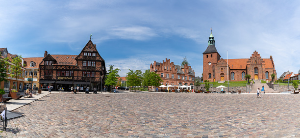 Svendborg, Denmark - 10 June, 2021: panorama view of the city square and historic town hall and cathedral in Svendborg