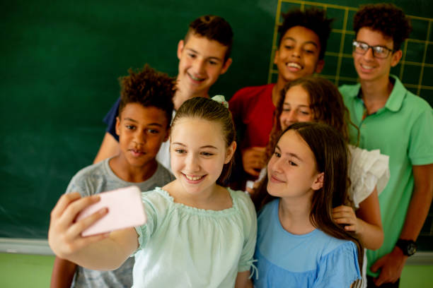 istock Kids taking selfies. School is almost finished. 1326638269