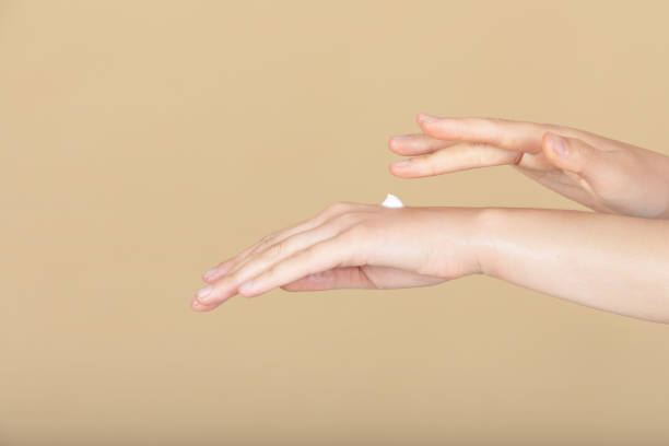 istock female hands and lotion 1326639235