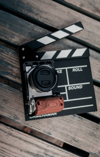 istock Digital camera and movie clapper 1326642047