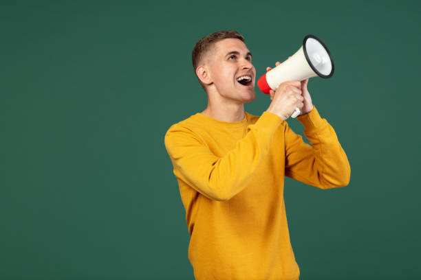 istock Portrait of young Caucasian man posing isolated over green studio background with copyspace for ad. Concept of human emotions 1326642414