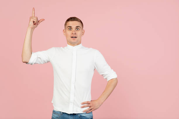 istock Portrait of young Caucasian man posing isolated over pink studio background with copyspace for ad. Concept of human emotions 1326642428