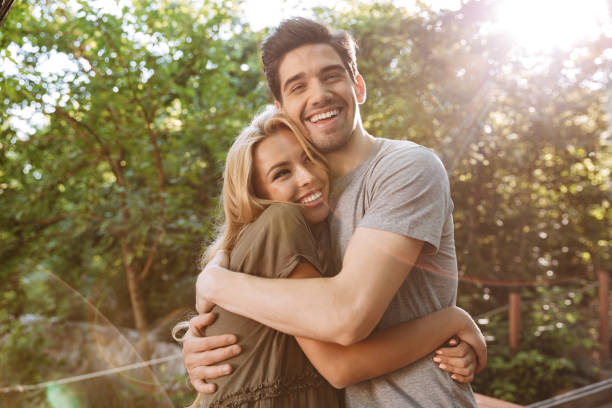 istock Cheerful lovely young couple hugging to each other 1326643262