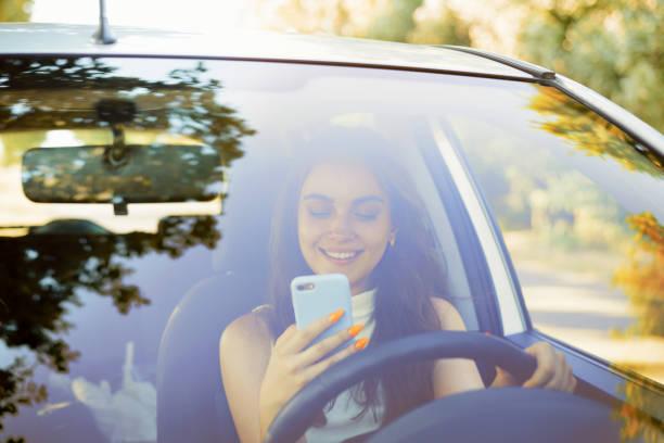 istock A teenager texting using her mobile phone and looking away from the road 1326643363
