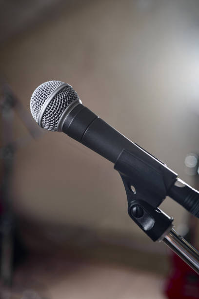istock A gray microphone on a stand taken in close-up. 1326644244