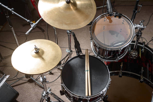 istock The drum kit is on the stage at the rehearsal base. Drumsticks is on a drum set. 1326644262